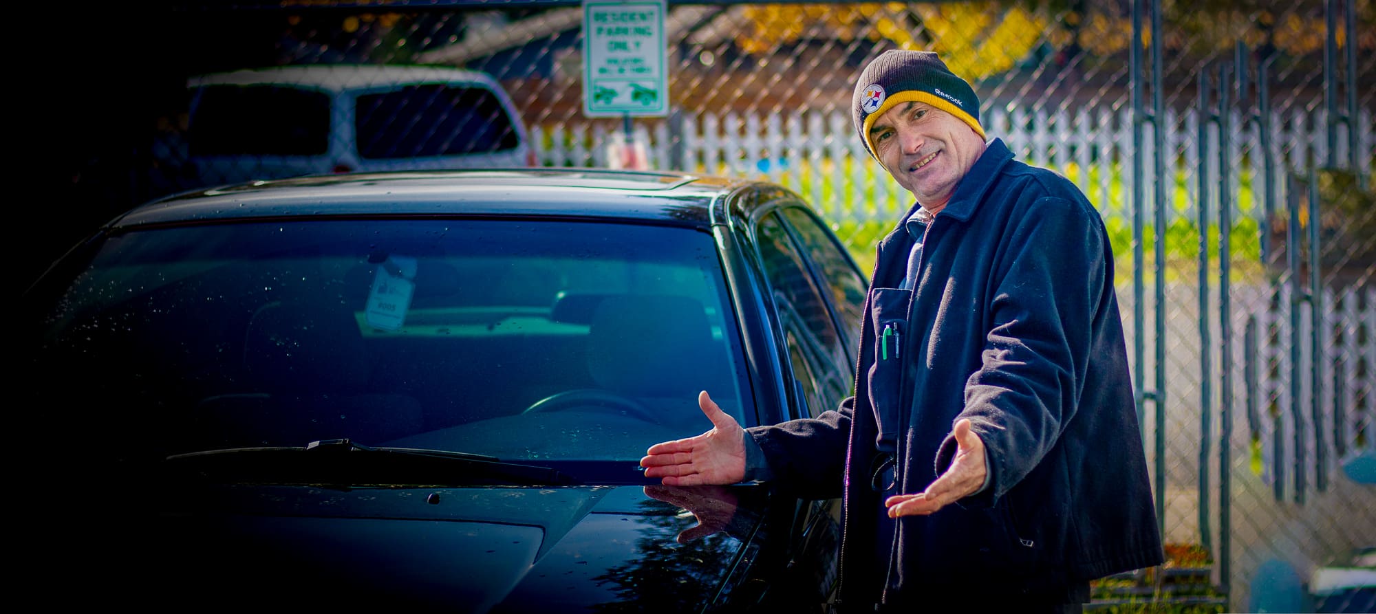 Resident James Poses by his new car.