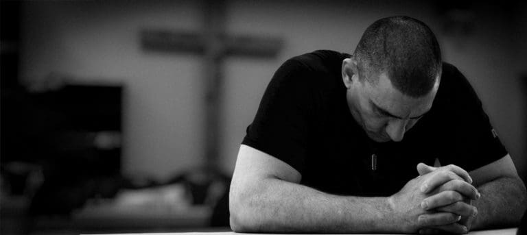 Resident Praying In Chapel
