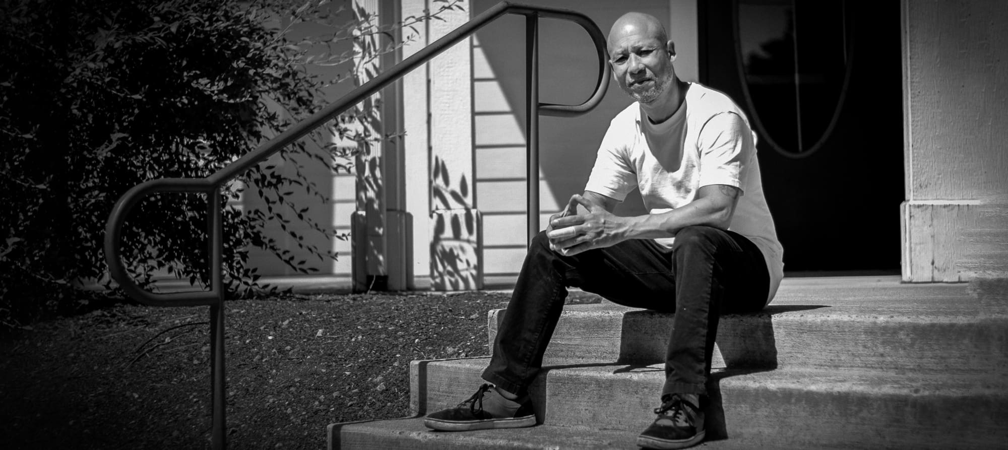 New Resident Todd sits on the Steps of the Mission