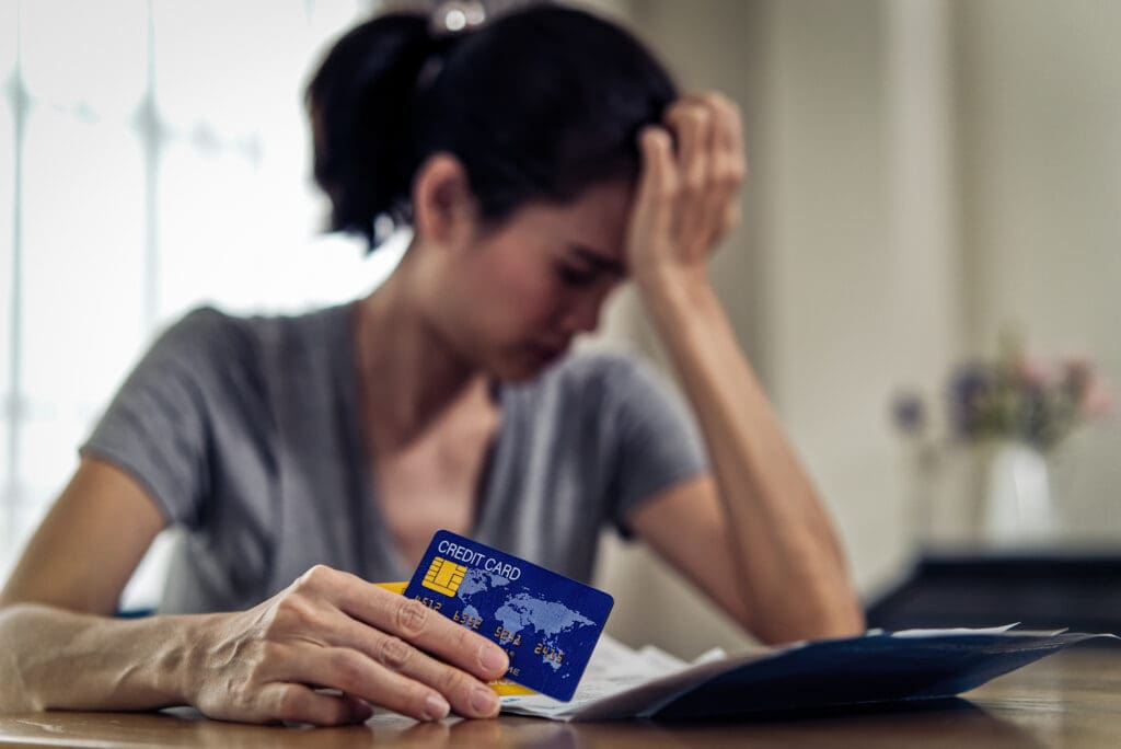 Distressed woman doing bills.